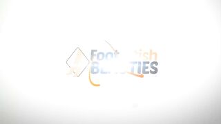 Two girls play footsies under the table