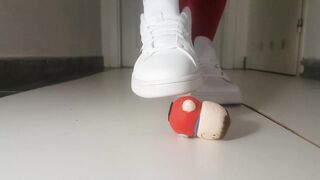 crushing little figurine