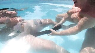 Camilla and Cheyenne Play with a double ended sex toy in the pool