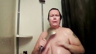 Jen is playing with her own boobs in the shower