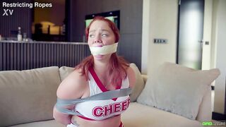 Cute Youthful red head bound and gagged by her intruder as cheer leader EP
