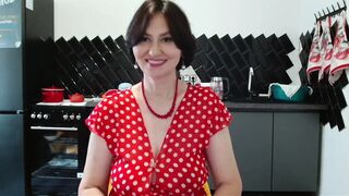 her polka-dot suit widen to the sides