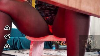 Black skinny thick woman flashes pants indooors