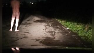 Risky in nature's garb on road with car passing
