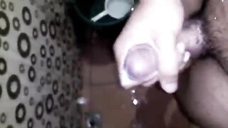 Lascivious Youthful Man Having Joy Jerking Off His Giant Rod in the Crapper