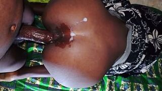 A tall, black Afro woman gets banged by a large knob