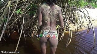 Slender tribe gal with a body full of mud exposed outdoor