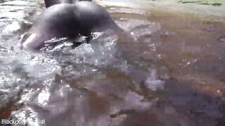 Slender tribe gal with a body full of mud exposed outdoor