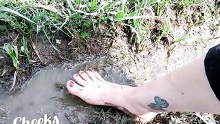 Exposed feet in mud