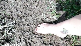 Exposed feet in mud