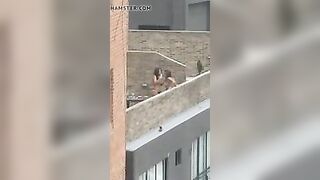 Lesbian strap-on on rooftop