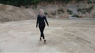 Grandma is walking around a gravel pit in constricted leggings and high heels!