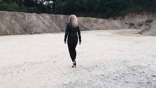 Grandma is walking around a gravel pit in constricted leggings and high heels!