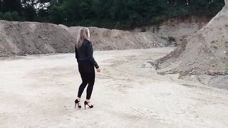 Grandma is walking around a gravel pit in constricted leggings and high heels!