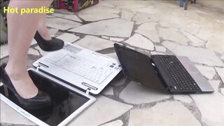 Hot woman destroys two laptops with her high heels and with a hammer