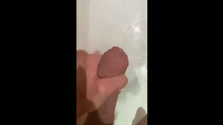 Slutty large shlong stud stroking in the baths, cumming in bathwater over feet, masturbating uncut large shlong