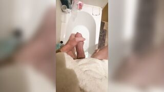 Slutty large shlong stud stroking in the baths, cumming in bathwater over feet, masturbating uncut large shlong