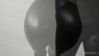 Headmistress shows her taut legs and nice-looking booty in ebony leather panties