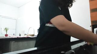 A nasty brunette hair, doing the dishes and chatting.