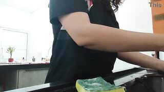 A nasty brunette hair, doing the dishes and chatting.