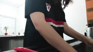 A nasty brunette hair, doing the dishes and chatting.