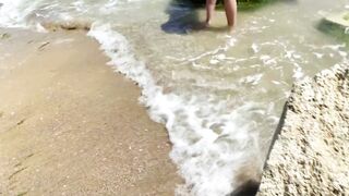 Alice is relaxing on the sea on a wild beach with a anal-plug in the butt