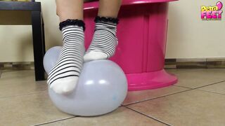 Petra plays with balloons and her feet