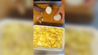 Peeling 'em Potatoe and greasing BACoN
