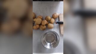 Peeling 'em Potatoe and greasing BACoN