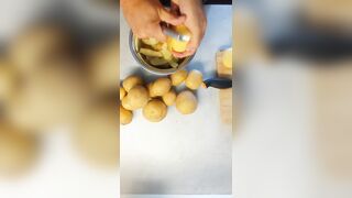 Peeling 'em Potatoe and greasing BACoN