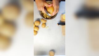 Peeling 'em Potatoe and greasing BACoN