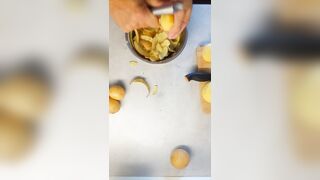 Peeling 'em Potatoe and greasing BACoN
