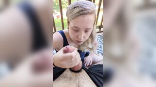 Blond chick gives head on the patio