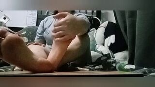 Trans male lubes up his feet