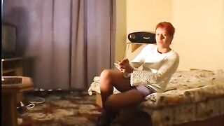 Great looking redhead banging her vagina with fingers