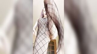 Thick legs widen wide in fishnet hosiery ?