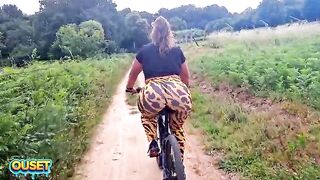 A large-assed woman in taut leggings rides a bike throughout the woods and ends up giving head and getting drilled outdoors with her biggest butt