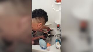 Charming gal gives kitten a washroom