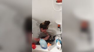 Charming gal gives kitten a washroom