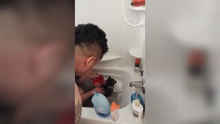 Charming gal gives kitten a washroom
