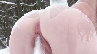 A red-haired gal pushed a giant icicle into herself in a winter forest. Ice in the snatch. Re-download. (AI).