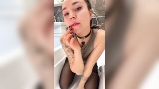 Tattooed cutie in nylons teases with her finger ?