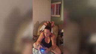 Marvelous angel in ebony mini costume lifts up her costume and play fortnite during the time that smokin' cigarettes
