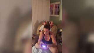 Marvelous angel in ebony mini costume lifts up her costume and play fortnite during the time that smokin' cigarettes