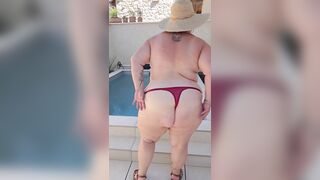 I show myself exposed outside next to the pool