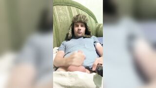 A man lies down, jerks off, cums, eats cum, and plays with a lighter.