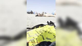 Stripped gal playing in the sand?