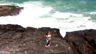 2 sexually excited lesbian babes head to the rocky beach to go down on every other, kiss, and finger every other.