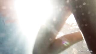 Mia and Petra strip eachother in the swimmingpool