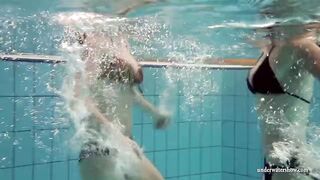 Mia and Petra strip eachother in the swimmingpool